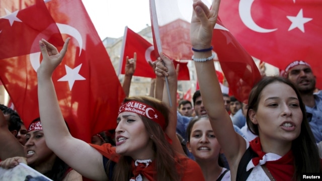 Demonstrators wave Turkish flags as they shout nationalist slogans during a protest against Kurdistan Workers' Party (PKK) in central Istanbul, August 16, 2015.