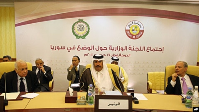 Arab League Secretary General, Nabil Elarabi, left, Qatari Prime Minister Sheikh Hamad bin Jassim bin Jabr al-Thani, center, and Ahmed bin Heli, the Arab League's assistant secretary-general for political affairs, during the group's meeting on Syria held 