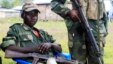 M23 rebels keep watch near a United Nations peacekeepers check point at Kanyaruchinya village, 3km north of Goma city on May 15, 2013. 
