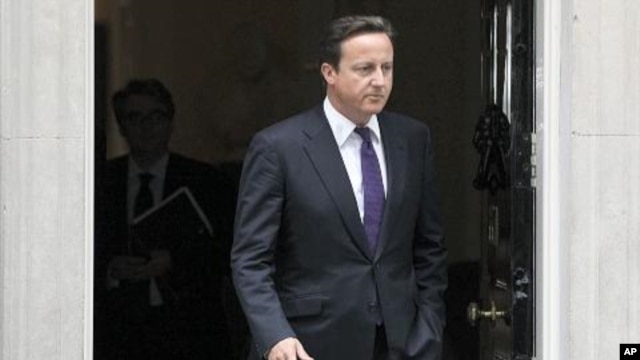 Britain's Prime Minister David Cameron leaves Downing Street in London, to attend Parliament, August 11, 2011