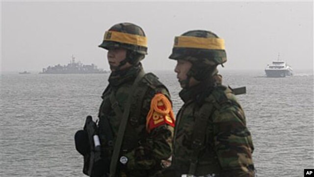 South Korean marines stand guard on Yeonpyeong Island, South Korea, 17 Dec 2010