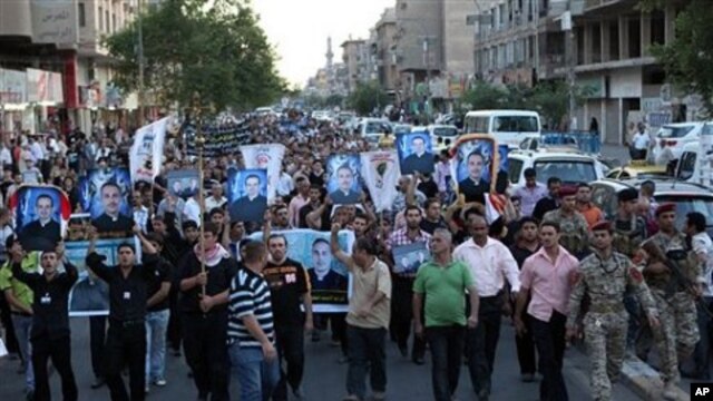 Muslims and Christians chant anti-terrorist slogans during a funeral of slain Christians in Baghdad, Iraq, 02 Nov 2010