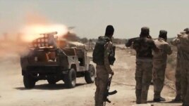 Các lực lượng an ninh Iraq và dân quân Shia đồng bắn tên lửa vào các vị trí của phe Nhà nước Hồi giáo ở Saqlawiyah gần Fallujah, Iraq.
