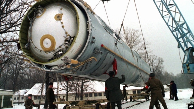 Soldiers prepare to destroy a ballistic SS-19 missile in the yard of the largest former Soviet military rocket base in Vakulenchuk, 220 kilometers (137 miles) west of Kyiv,  Dec. 24, 1997. 