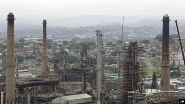 Chimneys from the Engen oil company are seen on the outskirts of the city of Durban, South Africa, the site of the COP17 climate talks, November 30, 2011.