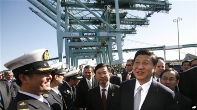 Chinese Vice President Xi Jinping , right, shakes hands with officers as he tours China Shipping at the Port Of Los Angeles in San Pedro, Calif. on  Feb. 16, 2012.