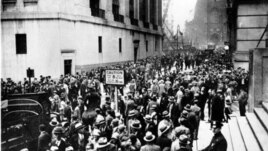 Crowds gather in the Wall Street district of Manhattan in reaction to the heavy losses on the stock market on October 24, 1929, or 