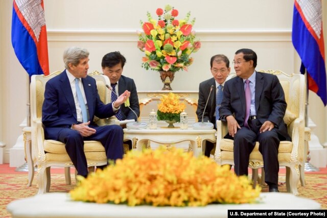 FILE - U.S. Secretary of State John Kerry, left, addresses Cambodian Prime Minister Hun Sen at the outset of a bilateral meeting at the Peace Palace in Phnom Penh, Cambodia, Jan. 26, 2016.