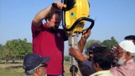 Researchers collect sample sediment cores to chronicle changes in the Indus landscape over time. (Peter D. Clift/University of Aberdeen)