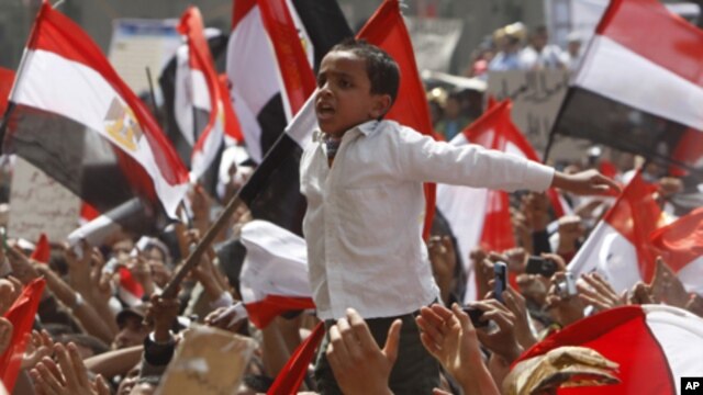 A young Egyptian protester shouts slogans at Tahrir Square in Cairo, April 1, 2011