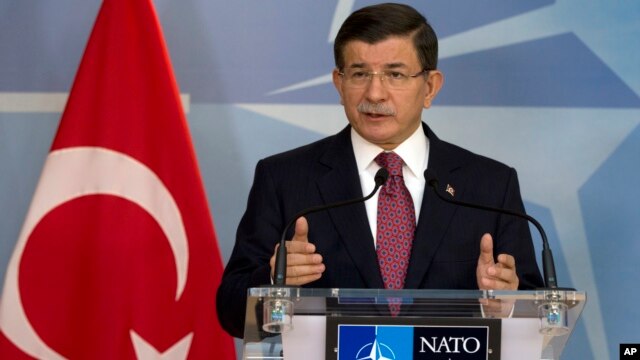 Turkish Prime Minister Ahmet Davutoglu speaks during a media conference at NATO headquarters in Brussels on Nov. 30, 2015.