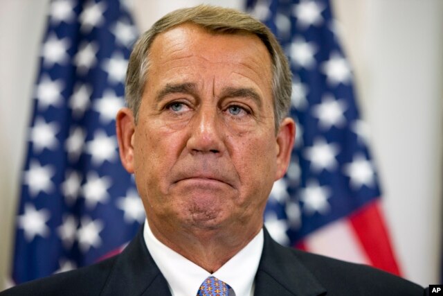 FILE - In this Sept. 9, 2015, file photo, Speaker of the House John Boehner pauses during a news conference with members of the House Republican leadership on Capitol Hill in Washington.