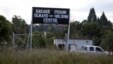 FILE - An image taken Apr. 15, 2010, shows a sign posted outside Harare Prison in Harare, Zimbabwe.