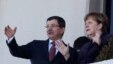 German Chancellor Angela Merkel, right, and Turkish Prime Minister Ahmet Davutoglu speak as they look towards the city center after a welcome ceremony in Ankara, Turkey, Monday, Feb. 8, 2016. 