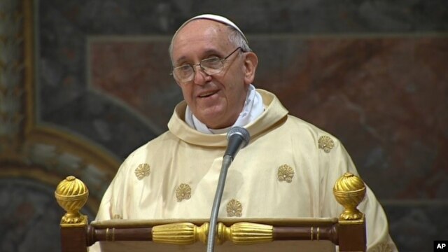 In this image made from video provided by CTV, Pope Francis celebrates his inaugural Mass with cardinals inside the Sistine Chapel at the Vatican, March 14, 2013.