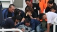 Family members cry around the body of Taiwanese fisherman Hung Shih-cheng after his boat, the Kuang Ta Hsing No. 28, arrived at Liuqiu port in Pingtung County, southern Taiwan, May 11, 2013. 