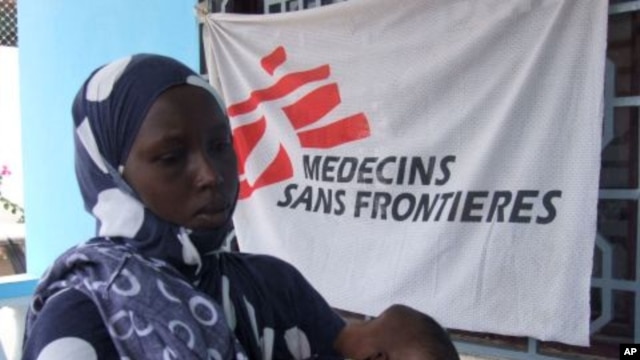 A Somali mother brings her child for vaccination for measles at a Medecines Sans Frontieres, Holland clinic hospital in Mogadishu, Somalia (File Photo).