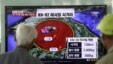 South Korean men watch a TV news program reporting missile launch conducted by North Korea, at a Seoul train station in Seoul, South Korea, May 20, 2013. 