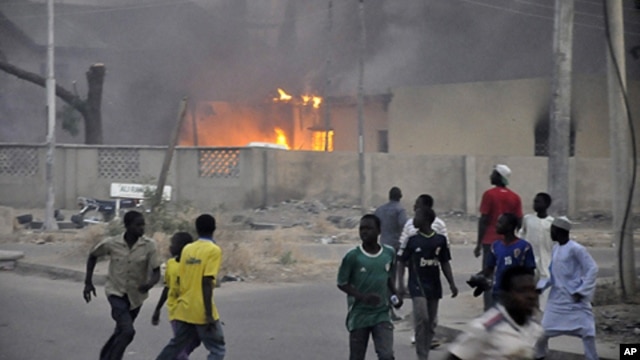 Smoke rising from police headquarters in Nigeria's northern city of Kano, Jan. 20, 2012.