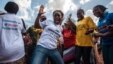 FILE - Women celebrate as their country is declared Ebola-free in Freetown, Sierra Leone, Nov. 7, 2015.
