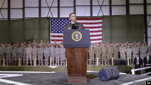President Barack Obama speaks to the troops at a rally during an unannounced visit at Bagram Air Field in Afghanistan, 03 Dec 2010