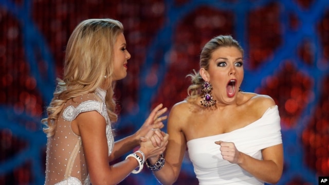 Miss New York, Mallory Hagan, right, reacts with Miss South Carolina Ali Rogers as she is crowned Miss America 2013 on Jan. 12, 2013, in Las Vegas.