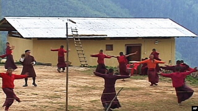 Young monks practicing a dance at the Neyphug Monastery