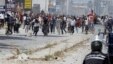 Supporters of Islamist group Ansar al-Sharia clash with riot police at Hai al-Tadamon in Tunis, May 19, 2013. 