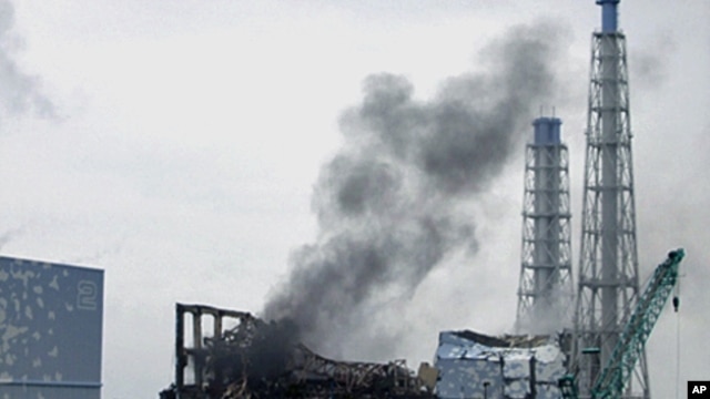 Smoke is seen coming from the area of the No. 3 reactor of the Fukushima Daiichi nuclear power plant in northeastern Japan, March 21, 2011
