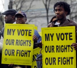 Voting rights activists gather in front of the U.S. Supreme Court in Washington Feb. 27, 2013.