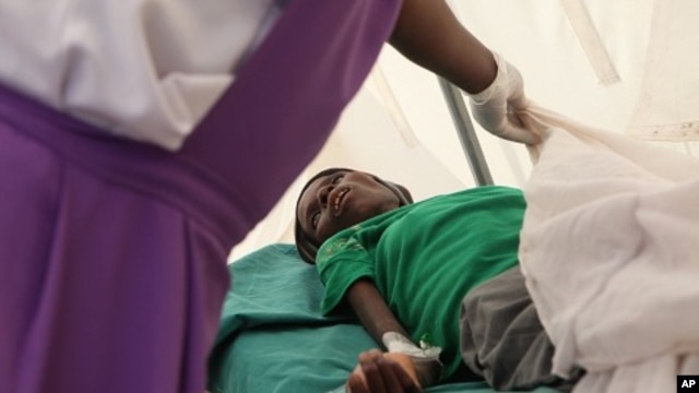 A patient suffering from HIV is taken to a local hospital in Harare, January 31, 2012. 