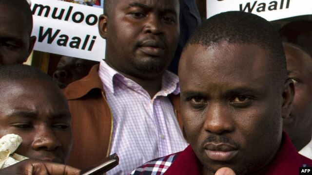 FILE - Kampala Lord Mayor Erias Lukwago (R) address the media outside the Buganda Magistrates court, Uganda.