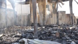 Debris from damaged buildings after gunmen stormed the headquarters of Al-Ikhbariya news channel near Damascus, June 27, 2012, in this handout photograph released by Syria's national news agency SANA.