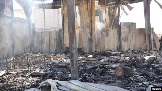 Debris from damaged buildings after gunmen stormed the headquarters of Al-Ikhbariya news channel near Damascus, June 27, 2012, in this handout photograph released by Syria's national news agency SANA.