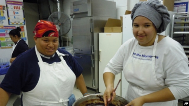 Tiffany Yanaway, 19, (r) and Katara Tyler, 17, are trainees at Sunflower Bakery, which helps people with learning disabilities find jobs in the baking industry.