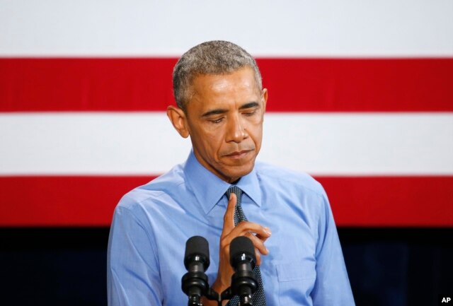 President Barack Obama pauses while speaking about the Flint, Michigan, water crisis, Jan. 20, 2016, at the United Auto Workers-General Motors Center for Human Resources in Detroit.