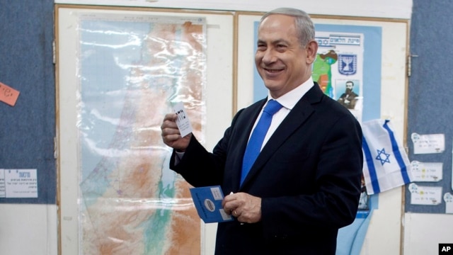 Israeli Prime Minister Benjamin Netanyahu casts his ballot at a polling station in Jerusalem, January 22, 2013.
