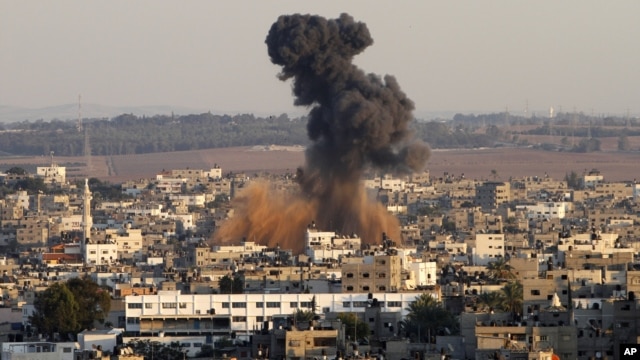 Smoke rises following an Israeli attack on Gaza City, Thursday, Nov. 15, 2012.