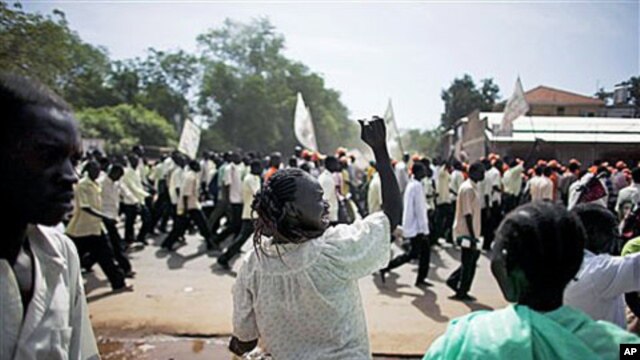 A southern Sudanese woman chants with pro-independence activists as they march through the southern capital of Juba, 09 Sep 2010