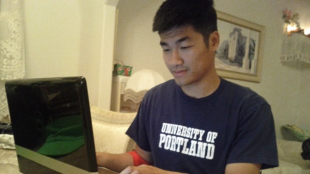 Engineering major Khang Nguyen, 22, checks his SmartyPig savings account