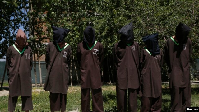 FILE - Insurgents suspected of being from the Haqqani network are presented to the media at the National Directorate of Security (NDS) headquarters in Kabul May 30, 2013.