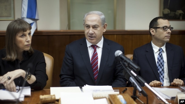 Israeli Prime Minister Benjamin Netanyahu, center, heads the weekly Cabinet meeting in his Jerusalem office, January 6, 2013.