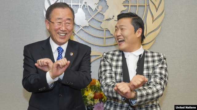 UN Secretary-General Ban Ki-moon, left, is taught how to dance 'Gangnam Style' by Korean rapper PSY during a photo opportunity at the UN headquarters in New York, October 23, 2012.