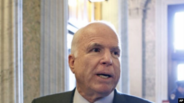 Senator John McCain talks to reporters on Capitol Hill, March 5, 2012.