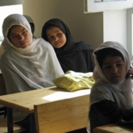 Afghan girls attend their first day of class at a school in the village of Deh Hassan.