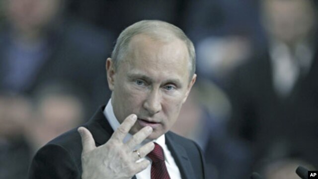 Russian Prime Minister Vladimir Putin speaks during a meeting with supporters, members of the All-Russia People's Front party, and political scientists, in Moscow, February 29, 2012.