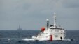 FILE - A Chinese Coast Guard vessel, with the disputed oil rig in the background, is seen in the South China Sea  June 13, 2014.