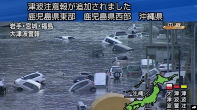 A screen grab taken from news footage by Japanese Government broadcaster NHK shows cars on a flooded street following the earthquake-triggered tsumani in Miyagi prefecture, March 11, 2011.