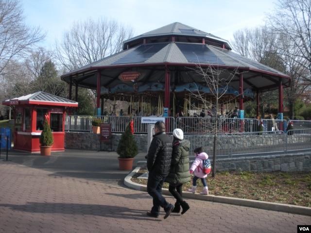 Solar panels on the roof power the National Zoo's Conservation Carousel, one of only two worldwide which runs on sunlight. (VOA/J. Taboh)