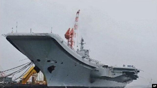 China's first aircraft carrier is seen at its shipyard at Dalian Port in northeast China's Liaoning province, in this still image taken from a July 27, 2011